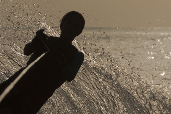 person waterskiing