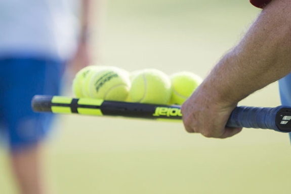 people on tennis court