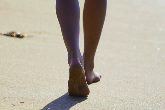 woman walking along the beach