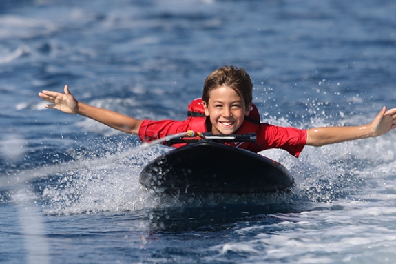 Young boy on kneeboard
