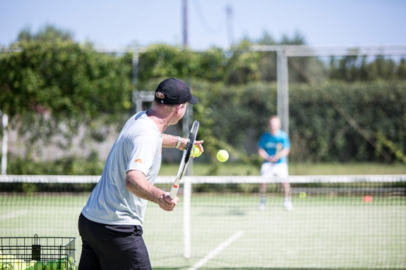 two people playing tennis