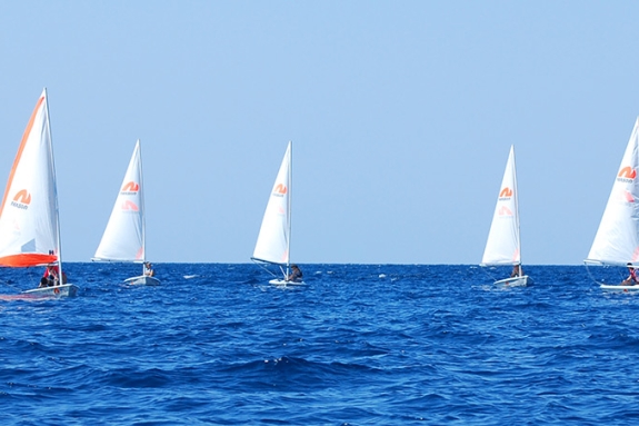Group of people sailing dinghies