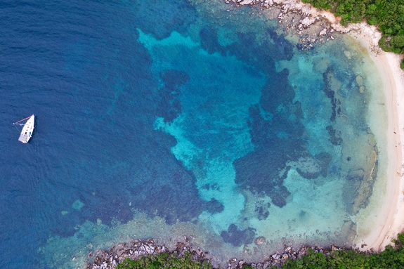 Aerial view of yacht in bay at Sivota, Greece