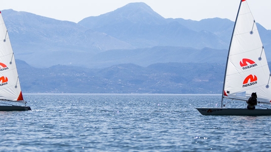 two people sailing Laser Dinghies