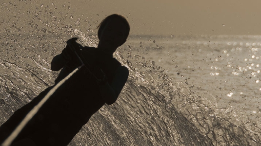 person waterskiing