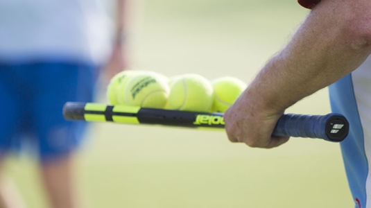 people on tennis court