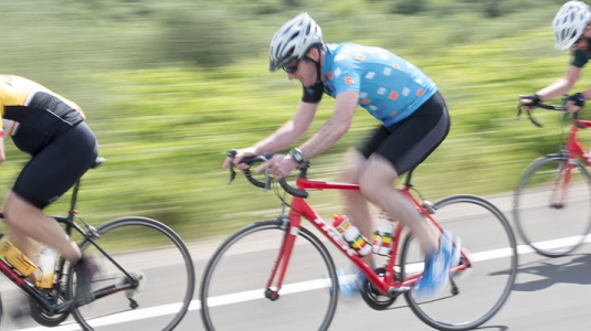 Group of people road cycling in Greece