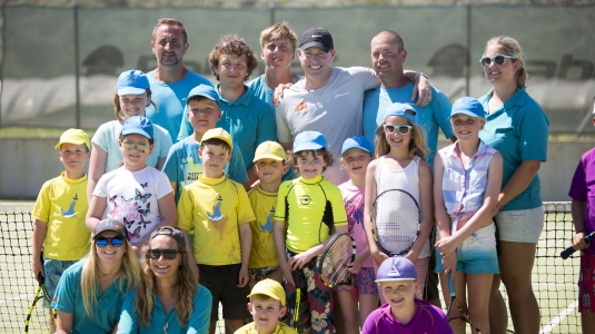 Group of children on tennis court