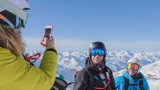 People posing for photo on a mountain in Val Thorens