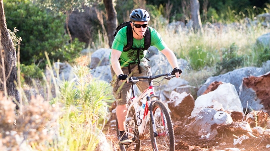 two men off road mountain biking