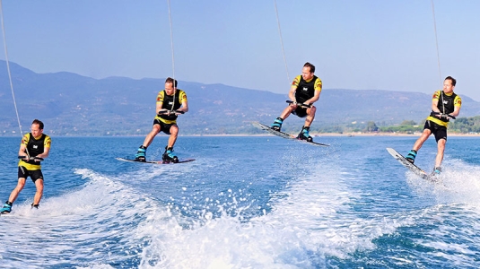 Jumping the boat wake on a wakeboard