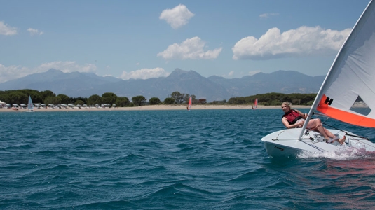 Woman sailing a dinghy