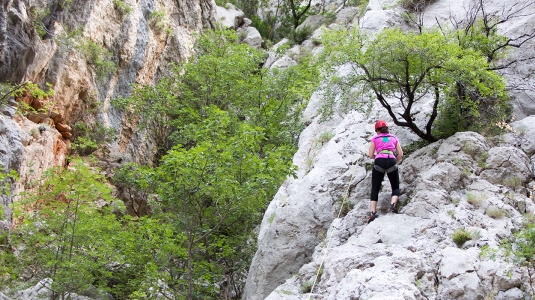 Girl rock climbing in the Paklenica National Park in Croatia