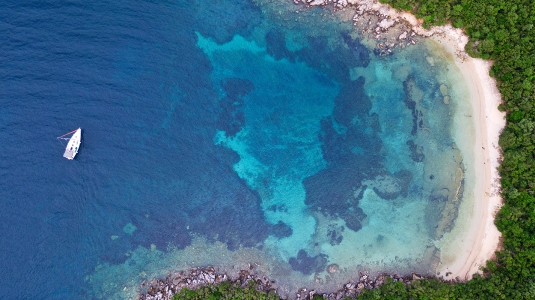 Aerial view of yacht in bay at Sivota, Greece