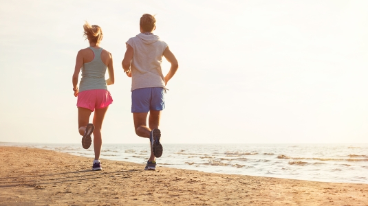 couple running on a beach