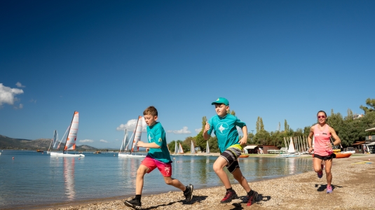 Kids running on a beach