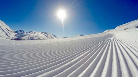 A beautifully groomed ski run