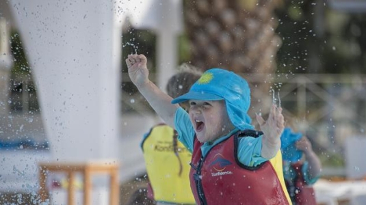 A child playing in a lifevest