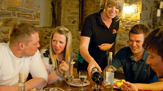 neilson host serving wine