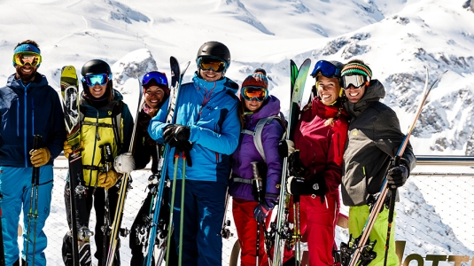 group of skiers and snowboarders