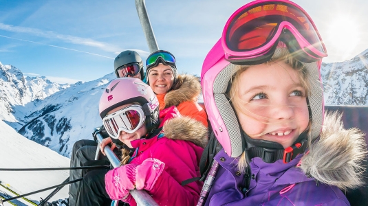family on a ski lift