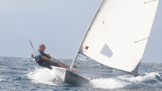 Angus sailing a Laser