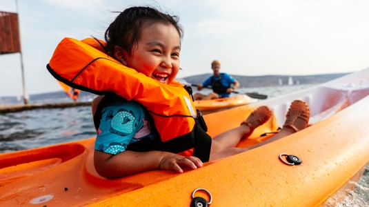 girl climbing and smiling