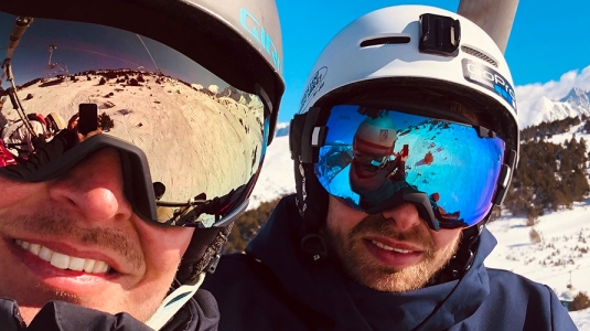 Snowboarders on a ski lift