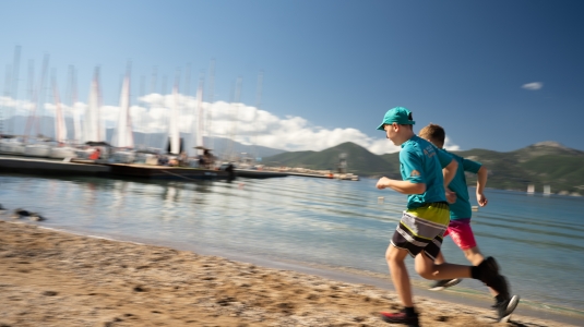 Children running on the waterfront