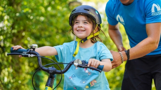 Little girl enjoying a bike ride