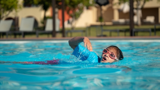 Girl swimming front crawl