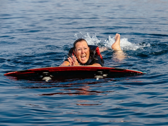 woman learning to wakeboard