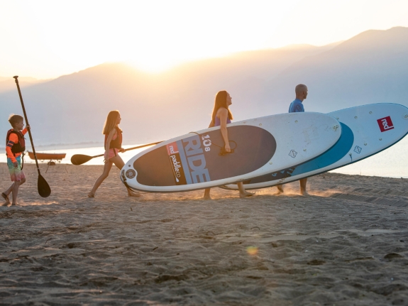 FAMILY ON PADDLE BOARDS