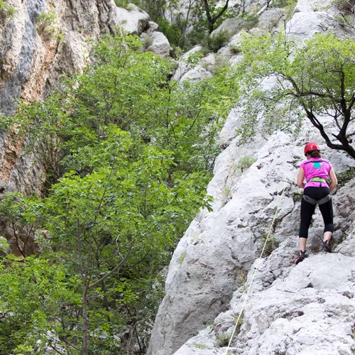 Girl rock climbing in the Paklenica National Park in Croatia