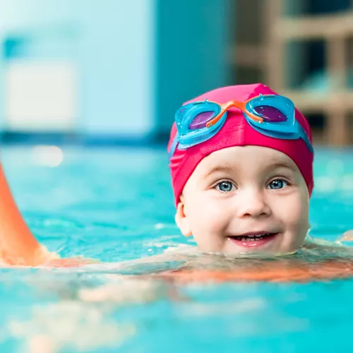 Toddler learning to swim