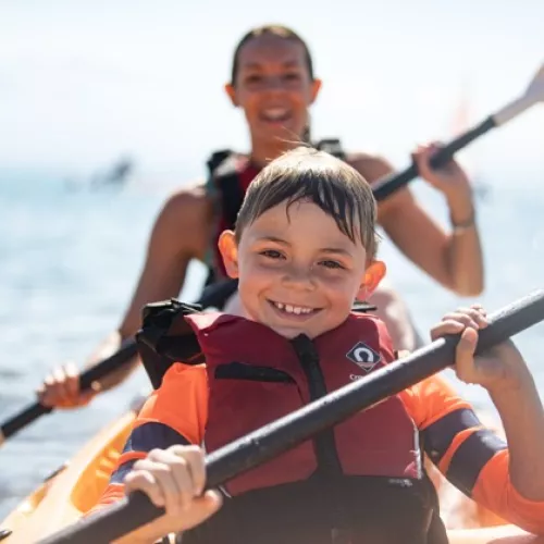 Mum and son kayaking in Greece