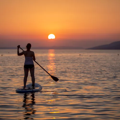 paddle boarding at sunset in croatia