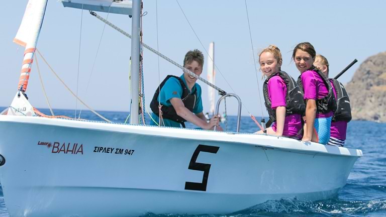 Wave Riders sailing a Laser Bahia with instructor on board