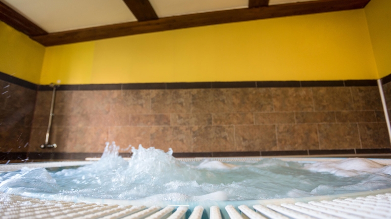 A large hot tub in the wellness area