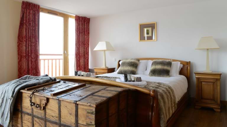 The bedroom in the exceptional suite