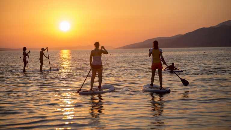 Paddle boarding at Alana Beach Club