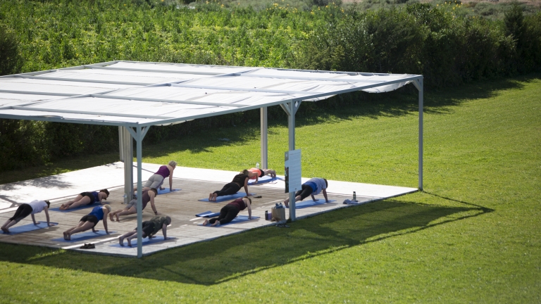 Fitness platform in the gardens at Buca Beach Club