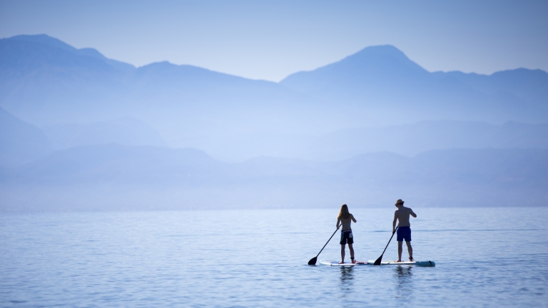 Paddle boarding at Buca Beach Club