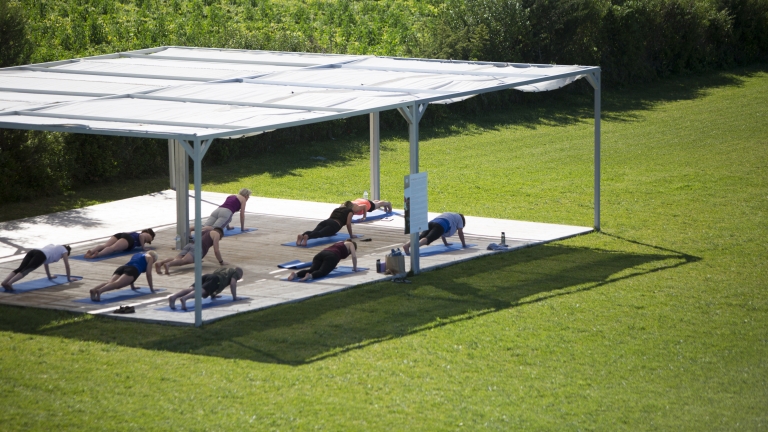 Fitness platform in the gardens at Buca Beach Club