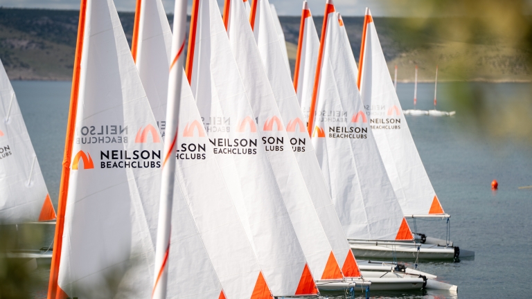 Dinghies lined up at Alana Beach Club