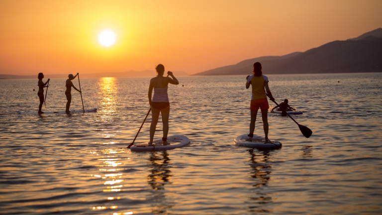 Paddle boarding at Alana Beach Club