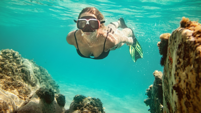 Snorkelling in the crystal clear waters at Neilson | Cook's Club Adakoy