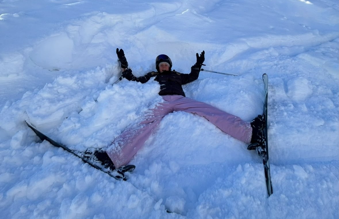 Girl making a snow angel