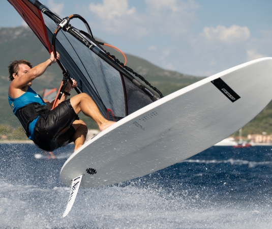 Windsurfer jumping at Cosmos Beach Club