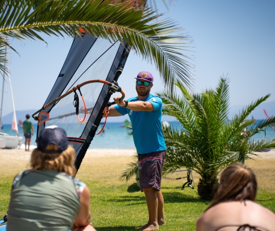 An instructor leads a windsurfing lesson